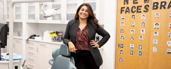 5 things you will not get with mail-order orthodontics 4 Dr. Parikh posing next to a dental chair