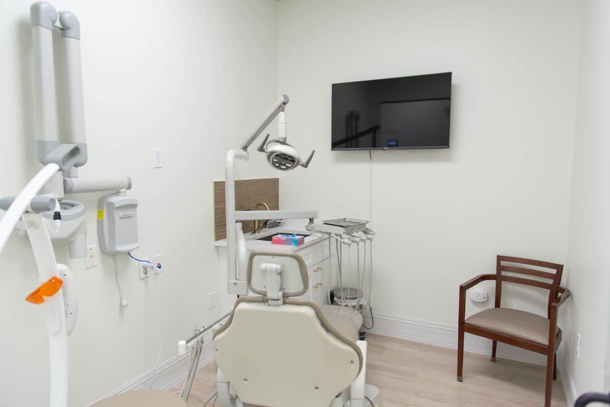 Contact us 4 Hidden smiles melville office private exam room with mounted television